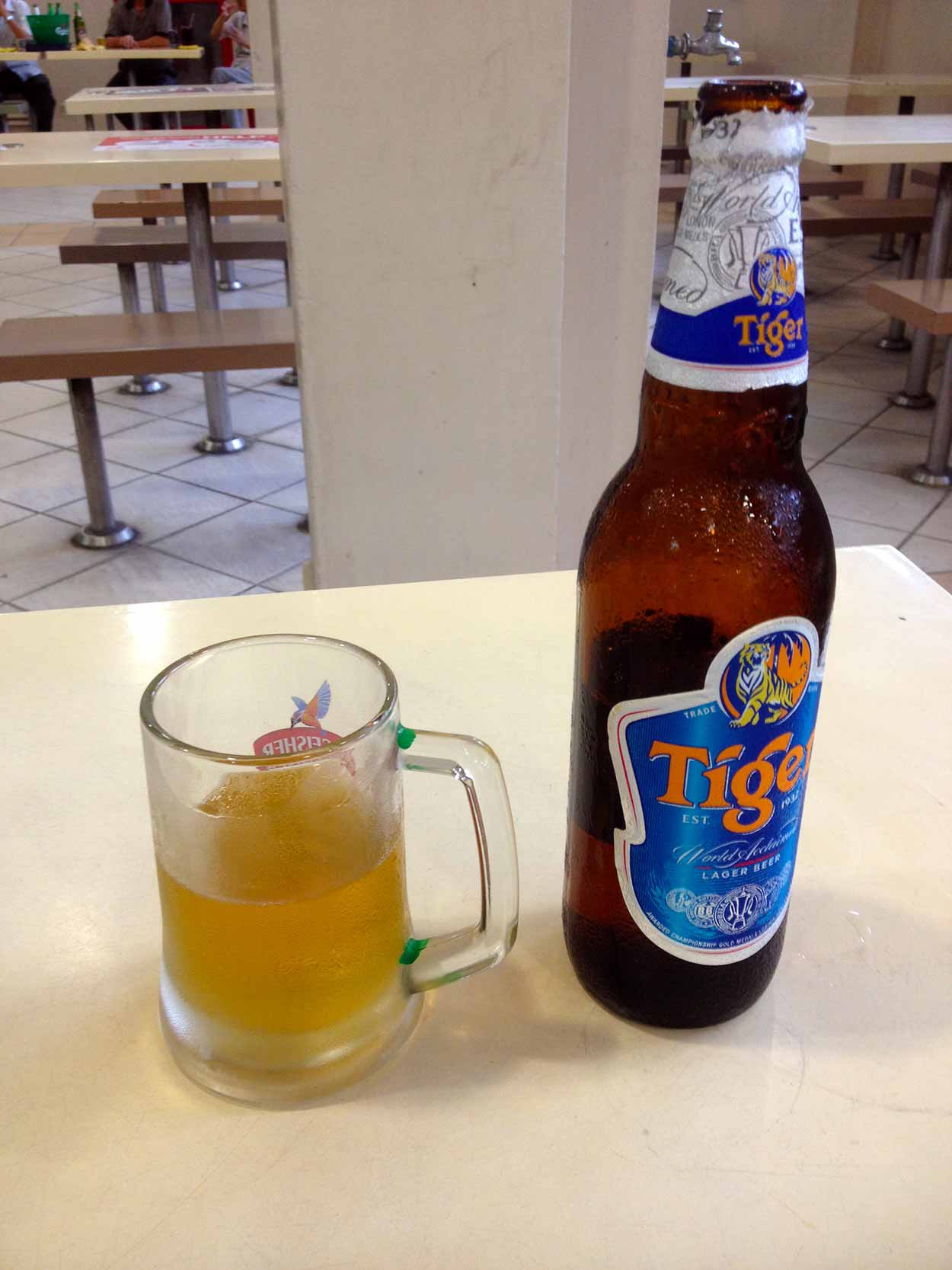 Enjoying a Tiger Beer at the Berseh Food Center, Little India, Singapore